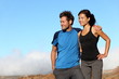 happy sporty couple looking