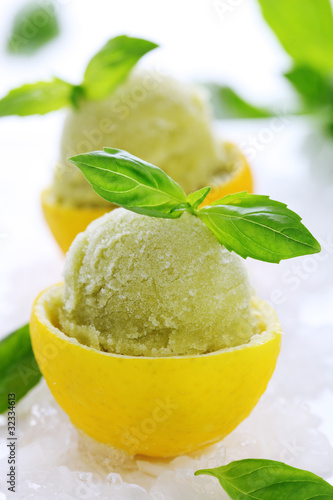 Photo: lemon- basil sorbet in cups of lemon lemon- basil sorbet in cups of lemon