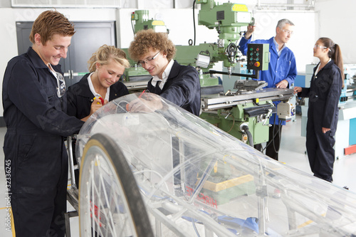 Photo: Students constructing electric vehicle prototype in vocational school Students constructing electric vehicle prototype in vocational school