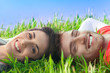 Happy couple lying in the grass Happy couple lying in the grass