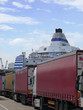 Semi-trucks in line waiting to board ferry boat