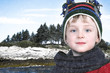Happy Boy in Winter Clothes at Lake Park in Snow Happy Boy in Winter Clothes at Lake Park in Snow