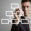 young businessman drawing diagram