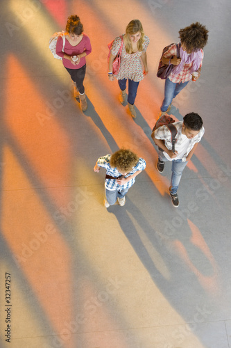 Photo: Students walking together in school corridor Students walking together in school corridor