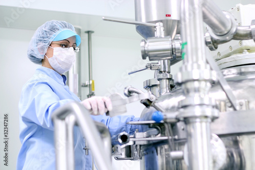 Photo: Pharmaceutical Worker At Work Pharmaceutical Worker At Work