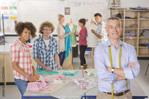Foto: Smiling teacher and students in home economics class Smiling teacher and students in home economics class
