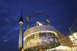World clock with the TV tower by night