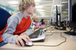 Serious student using computers in school computer lab