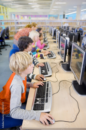 Photo: Serious students using computers in school computer lab Serious students using computers in school computer lab