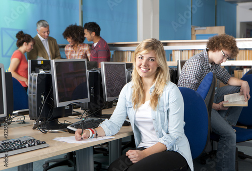 Photo: Smiling student studying in computer lab Smiling student studying in computer lab