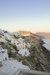 Pastel colored houses over the caldera in Oia, Greece Pastel colored houses over the caldera in Oia, Greece