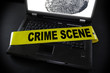 laptop fingerprint with crime scene tape across it