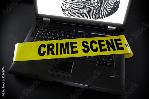 Photo: laptop fingerprint with crime scene tape across it laptop fingerprint with crime scene tape across it