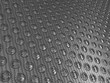 Carbon fibre surface with round buttons