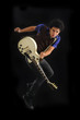 Guy jumping with electric guitar isolated