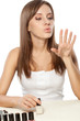 beautiful woman drying nails