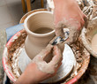 hands of a potter, creating an earthen jar on the circle hands of a potter, creating an earthen jar on the circle