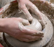 hands of a potter, creating an earthen jar on the circle hands of a potter, creating an earthen jar on the circle