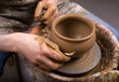 hands of a potter, creating an earthen jar on the circle hands of a potter, creating an earthen jar on the circle