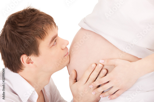 Photo: male face and pregnant woman belly male face and pregnant woman belly