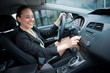 Foto: woman driving and changing radio station woman driving and changing radio station