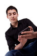 Young man looking at his smart phone. Young man looking at his smart phone.