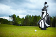 golf equipment on green and hole as background