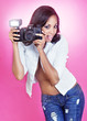 Pretty woman taking flash photo