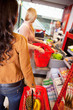 Customers carrying basket while shopping