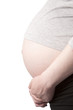 Foto: Pregnant belly from side with hands on white background Pregnant belly from side with hands on white background