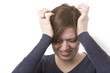 Foto: Woman with headache on white background Woman with headache on white background