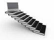 Staircase from books and laptop on the top