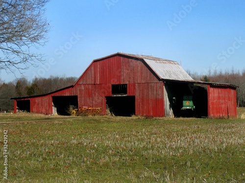 Photo: Rustic old red barn in summer Rustic old red barn in summer