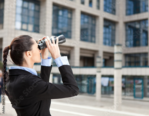 Photo: businesswoman looks into the future businesswoman looks into the future