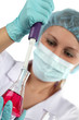 Photo: chemist with test tube and dropper chemist with test tube and dropper