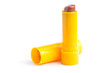 Red lipstick in yellow container over white background Red lipstick in yellow container over white background