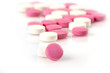 closeup of white and pink pills