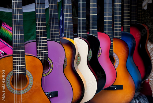 Photo: Row of multi-colored Mexican guitars Row of multi-colored Mexican guitars