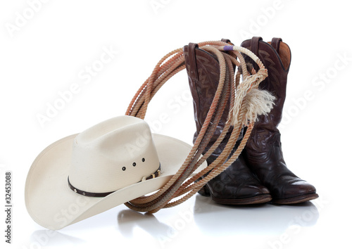 Photo: Cowboy hat, boots and lariat on white Cowboy hat, boots and lariat on white