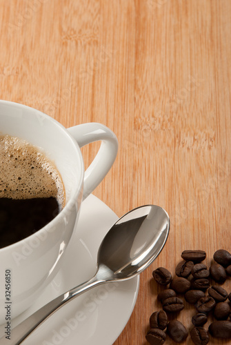 Photo: Coffee cup with spoon and beans Coffee cup with spoon and beans