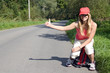 girl with rucksack stops the car..