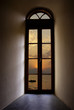 Sunset on a tropical beach through a Byzantine window, Greece