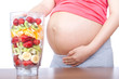 Pregnancy and nutrition - pregnant woman with fruit Pregnancy and nutrition - pregnant woman with fruit
