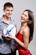 Photo: Elegant boy gives a present to his girl Elegant boy gives a present to his girl