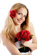 Pretty girl holding a bouquet of red roses
