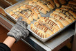 Hand pull out baked bread on tray