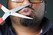 Man with scissors at his mouse