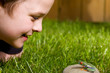 boy watching a frog