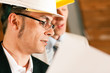 Architect and construction engineer discussing plan