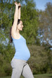 Photo: Pregnant woman stretching Pregnant woman stretching